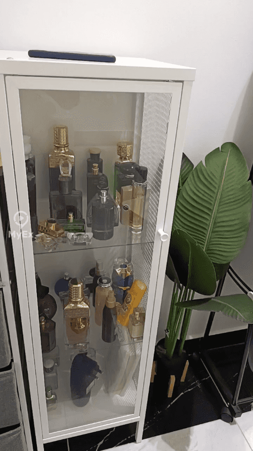 My experience with a stylish white storage cabinet with a transparent glass door, perfect for organizing perfumes and care products - image on MyEx