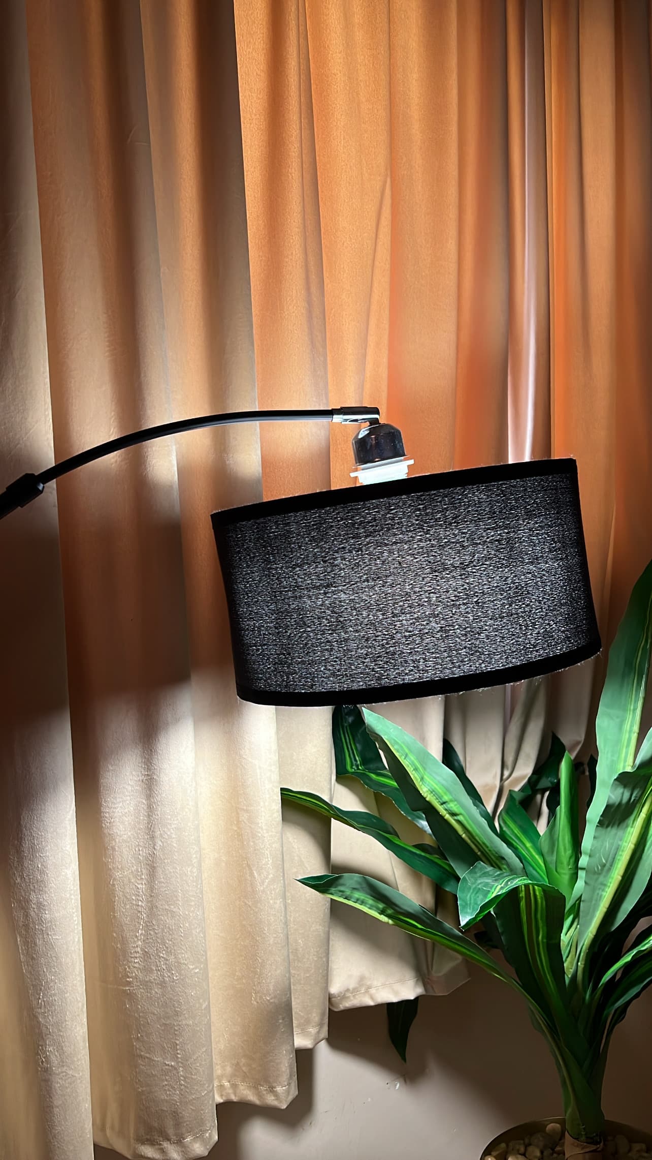 Close-up image of the floor lamp's base and its simple, space-saving design