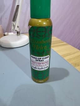 Close-up shot of the Elizabeth Helen makeup fixer bottle
