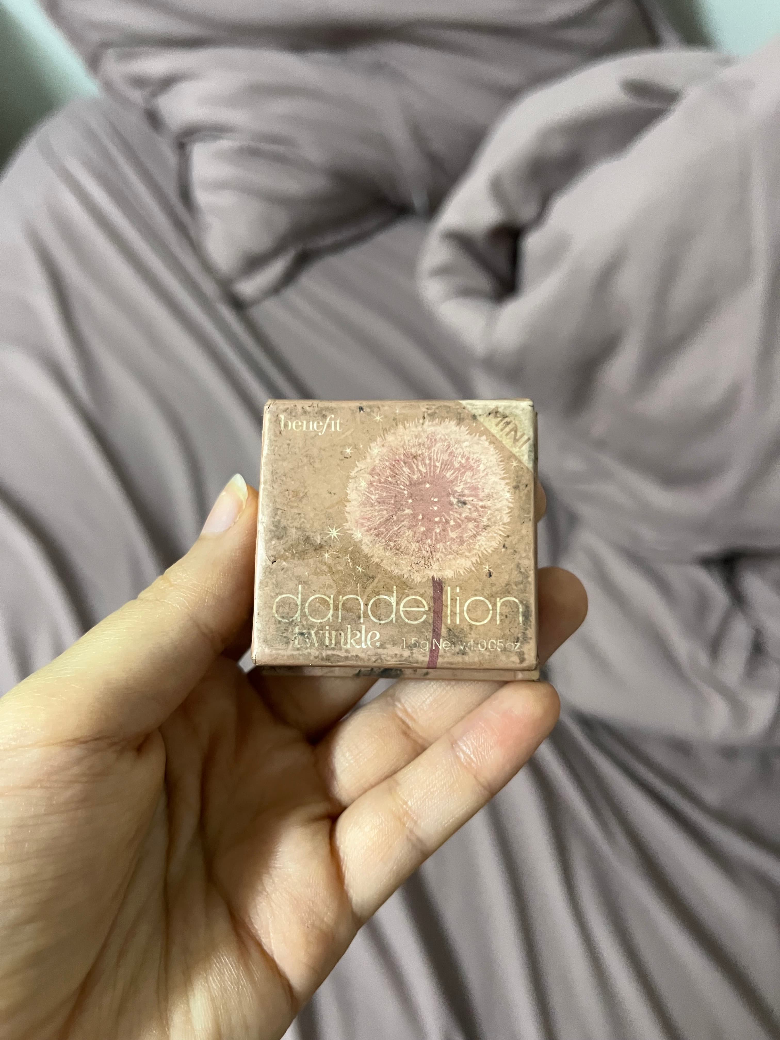 Close-up image of Dior Backstage Highlighter Palette swatches on hand
